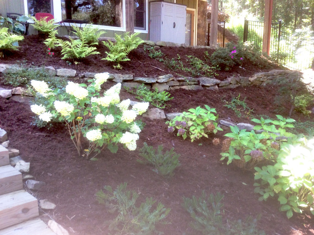 This is a sample of a beautiful rock flower beds, plants, and rock steps at a Blue Ridge Georgia Cabin Home - Blue Ridge Georgia Landscaping Project
