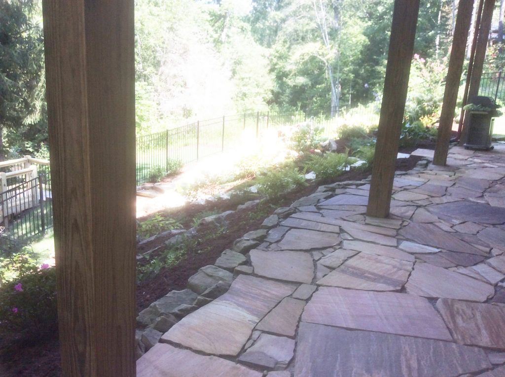 This is a sample of a beautiful rock patio and local plants created under a Blue Ridge Georgia Home - Blue Ridge Georgia Landscaping Project