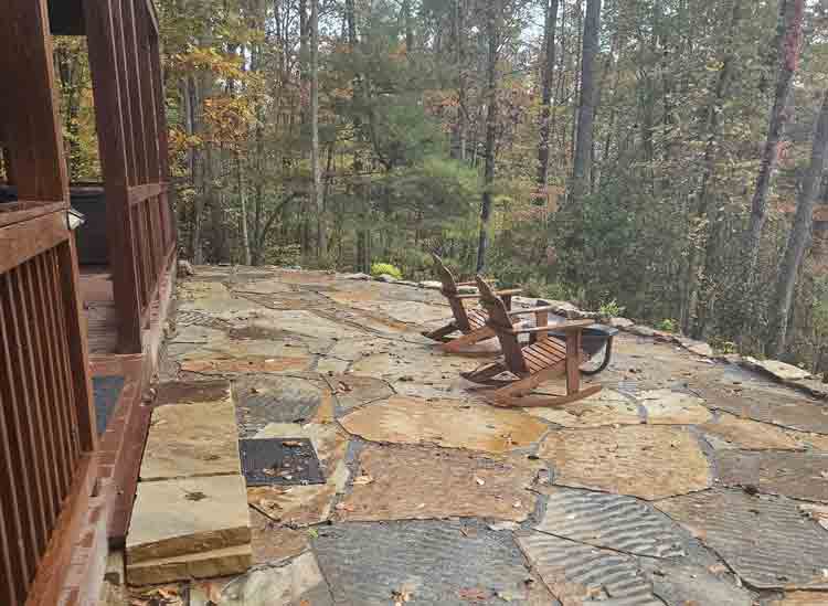 rock patio overlooking the north georgia mountains at a rental cabin