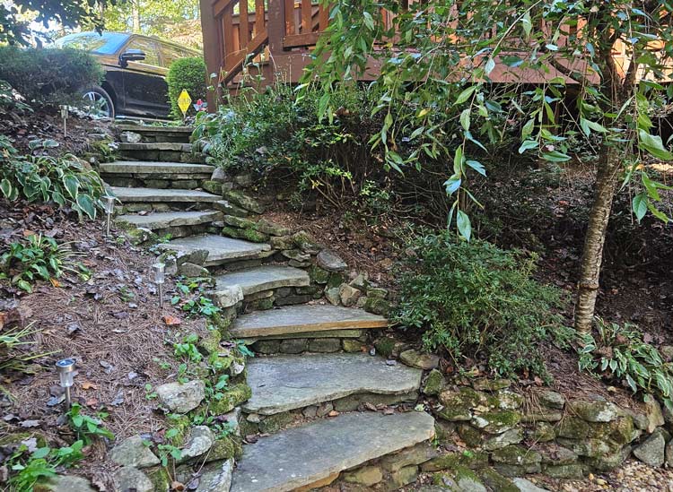 gray rock steps and plants beside a cabin in blue ridge georgia project completed in June of 2026